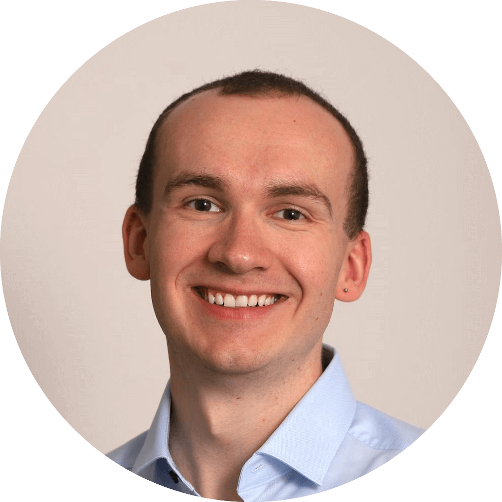 a man smiling at the camera