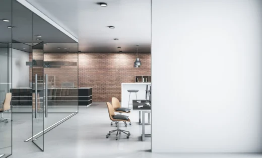 a room with a white wall and a table and chairs