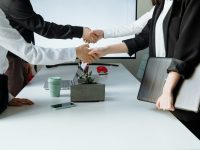 a group of people shaking hands