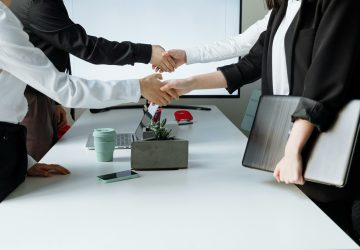 a group of people shaking hands