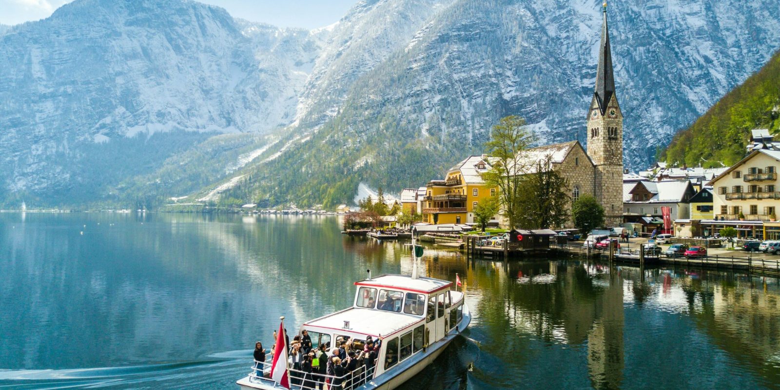 a boat on the water with mountains in the background