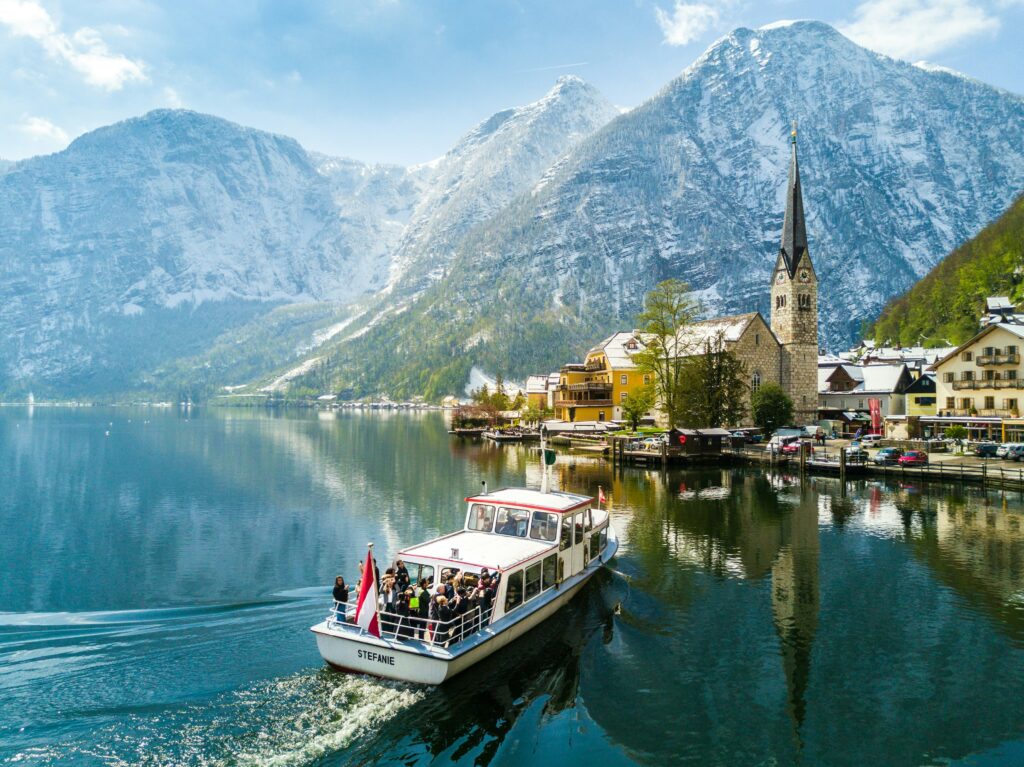a boat on the water with mountains in the background